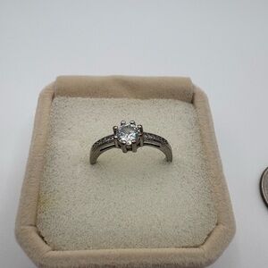 Classic Solitaire Engagement-Style Ring with Side Stones